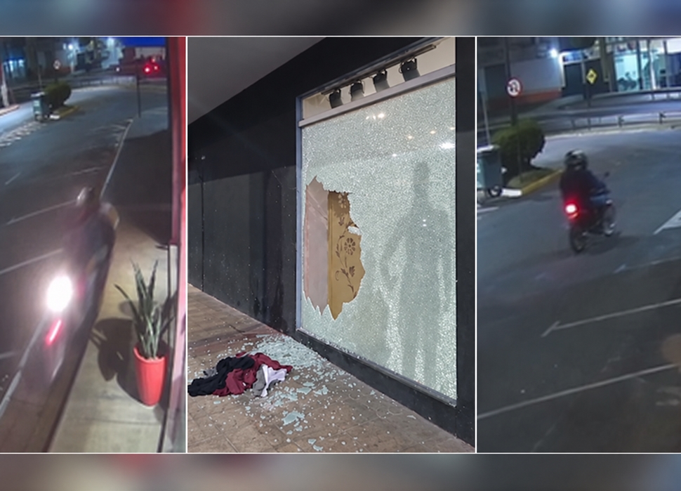 Dupla em motocicleta quebra vidraça e furta roupas de loja no centro